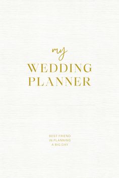 a white wedding planner with gold lettering