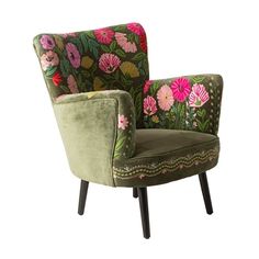 a green chair with pink flowers on the back and arms, sitting in front of a white background