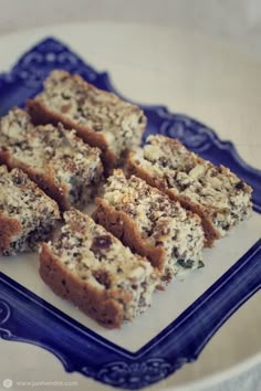 several pieces of cake on a blue and white plate