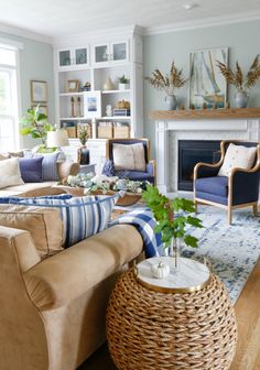 a living room filled with furniture and a fire place