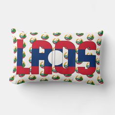 a white pillow with the word laos printed in red, blue and green on it