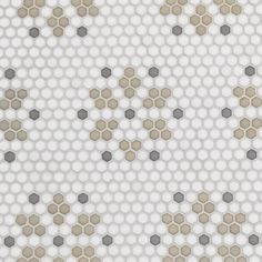 a white and grey tiled wall with hexagonal dots on it's surface