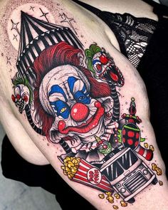 a clown tattoo on the right arm and shoulder