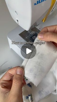 someone is using a sewing machine to sew fabric on the top of a piece of cloth