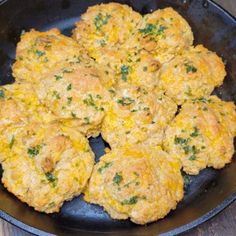 some food is cooking in a skillet on the table and ready to be eaten