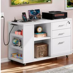 a white computer desk with drawers and shelves