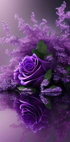 a purple rose sitting on top of a table next to some leaves and flowers in the water