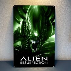 an alien movie poster is displayed on the wall