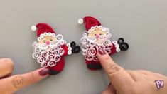 someone is pointing at the santa clause on their fingers