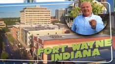 a man is standing on top of a building with the words fort wayne indiana in front of him