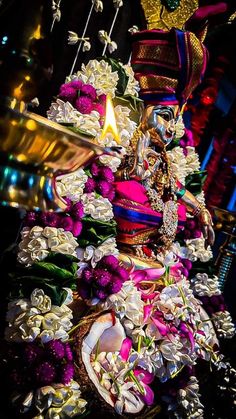 an elaborately decorated tree with flowers and decorations