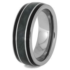 a wedding ring with black and white marble inlays on the inside of it