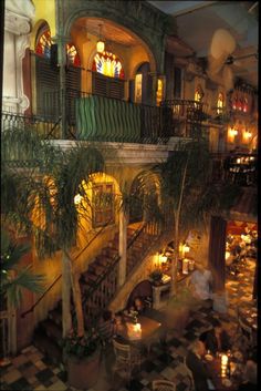 the interior of a restaurant with many tables and chairs