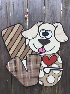 a wooden sign with a dog holding a heart