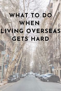 an empty street with cars parked on both sides and the words what to do when living overseas gets hard