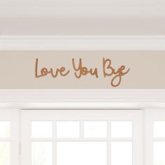 the word love you be spelled in copper foil on top of a window sill