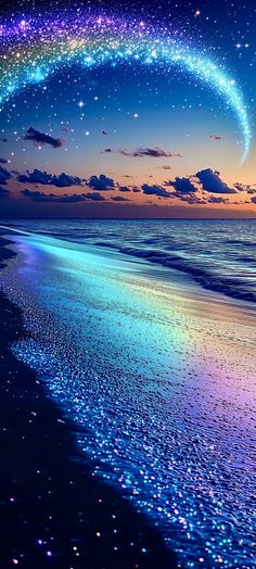 an image of the ocean with stars in the sky above it and a rainbow - hued beach