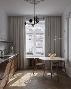 a dining room table and chairs in front of a window