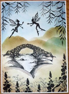 a card with two fairy flying over a bridge