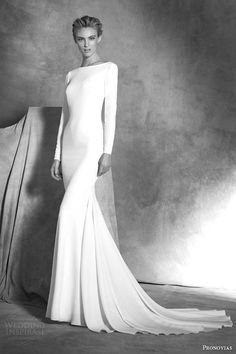 a black and white photo of a woman in a long - sleeved wedding dress