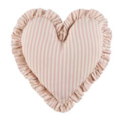 a pink and white heart shaped pillow with ruffles on the edges, against a white background