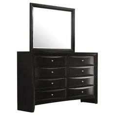 a black dresser with mirror on top of it