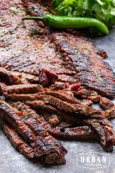 the steak is ready to be grilled and served with green peppers on the side