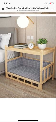 a bed sitting next to a wooden table in a bedroom