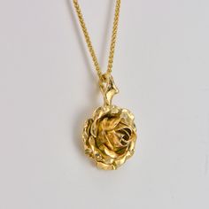 Rose Flower Necklace, 9k Yellow Gold Pendant, Gold Rose Necklace Beautiful yellow rose suspended by delicate thorns, A truly romantic gift! handcrafted in 9ct yellow solid gold * Material: 9ct Fairtrade / recycle UK hallmarked gold * Size of Rose: Approx 1.5 cm (0.4in) diameter * Length of Chain: hallmarked 1 mm Spiga chain 40 cm (16in) long (it could be longer on request ) * Ready to Ship in 10 business day * Made in the United Kingdom Please allow for slight variations in size as every item is Golden Rose Necklace, Flowers Moodboard, Gold Rose Necklace, Rose Pendant Necklace, Shiny Rings, Jewelry Rose Gold, Minimalist Jewellery, Graduation Jewelry, Minimalist Pendant