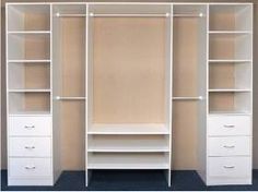 an empty white closet with shelves and drawers