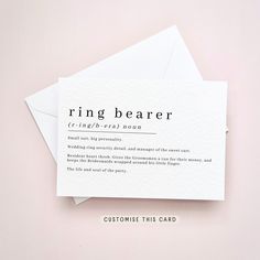 two white envelopes sitting on top of each other with the word ring bearer printed on them