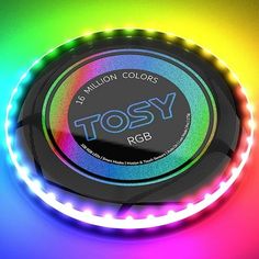 a neon colored frisbee with the word tosy on it