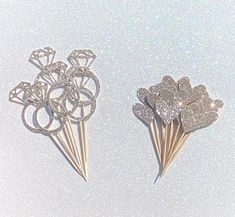 there are two pins that have been made to look like flowers