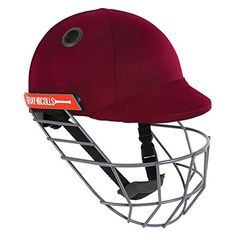 a baseball helmet that is on top of a metal stand with a red visor