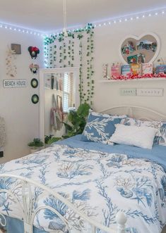 a bed with blue and white bedspread in a bedroom