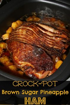 a close up of food in a crock pot with meat and potatoes on the side