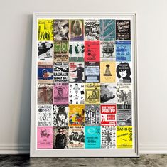 a white framed poster with many different types of posters on it's side wall