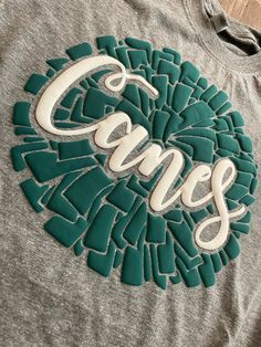 Custom team name/mascot puff pom pom tee. Please at color of shirt, color of writing, and team name/mascot in notes at checkout. Puff Tshirt Design, Puff Vinyl Designs, Green School Spirit T-shirt For Fan Gear, Vinyl Tshirt Ideas, Puff Vinyl Sweatshirt, Puff Vinyl Shirt Ideas, Puff Print Tshirt, Puffy Vinyl, Puff Htv