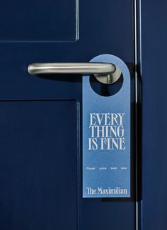 a door handle on a blue door with the words every thing is fine written on it