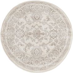 a round rug with an intricate design on the center and sides, in grey tones