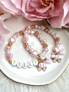 The sweetest princess bracelet and necklace gift set. Each item can be purchased individually or as a set. Necklace is 16 inch with a 1' extender (if you would like a different size just include the size in the personalised notes section). MATCHING EARRINGS AVAILABLE HERE! https://withlovejessieshop.etsy.com/listing/1787371534 ♥ MATERIALS ♥ NECKLACE - 18K Gold Plated Chain over brass - with carriage charm and initial letter BRACELET - Glass beads and imitation pearls, with carriage charm  ♥ HOW TO ORDER ♥ SIMPLY JUST CHOOSE YOUR ITEM AND SIZE THEN ADD THE NAME YOU WOULD LIKE IN THE PERSONALISED BOX ALONG WITH ANY OTHER PERSONALISATION REQUESTS (IF PURCHASING THE BRACELET) ♥ SHIPPING ♥ All items are sent via AUSTRALIA POST LETTER SERVICE - untracked Please allow 1-4 weeks for your item to b Princess Bracelet, Girls Bracelet, Princess Carriage, Letter Bracelet, Australia Post, Set Necklace, Childrens Gifts, Personalised Box, Pink Princess