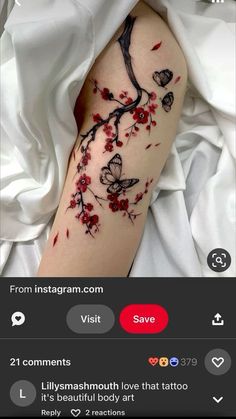 a woman's arm with red flowers and butterflies on it, in the middle of an instagram