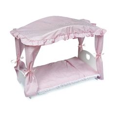 a pink and white bed with a canopy on it's headboard, sitting in front of a white background