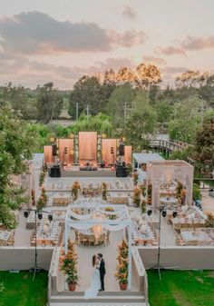 an aerial view of a wedding venue at sunset