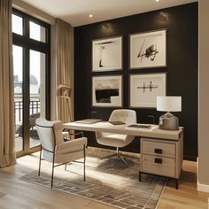 an office with black walls and white furniture in front of a large glass door that leads to a balcony