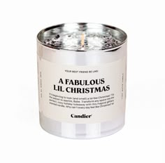 a candle that is inside of a tin with the words fabulous christmas written on it