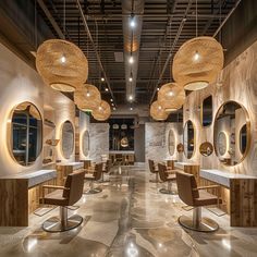 the interior of a hair salon with chairs and mirrors