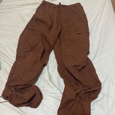 Brown Parachute Pants With Adjustable Waist And Ankles, Featuring Cargo Pockets And A Drawstring At The Waist. Never Worn It And It Basically Like New. Brown Parachute Pants, Cargo Parachute Pants, High Rise Boyfriend Jeans, Size 6 Jeans, Adriano Goldschmied Jeans, Levi’s Jeans, Raw Hem Jeans, Ankle Leggings, Cut Off Jeans