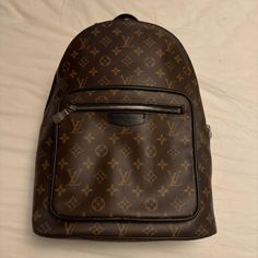 Great Condition, Only Worn Twice! Small Scuff On Top Of Bag See Photos And One Corner On The Bottom Has A Small Rub Also See Photo. Bottom Corner Of Front Pocket Has A Texture To It. Not Sure What That’s From. Doesn’t Affect The Bag In Anyway. This Louis Vuitton Josh Backpack Is A Stylish And Practical Accessory For Any Man Or Woman. Made From High-Quality Monogram Macassar Canvas, It Features An Adjustable Shoulder Strap And A Zip-Around Closure For Maximum Comfort And Security. The Bag Is Wate Beige Color Scheme, Designer Backpack, Monogram Backpack, Designer Backpacks, Louis Vuitton Monogram, Front Pocket, Louis Vuitton Bag, Outdoor Activities, Shoulder Strap