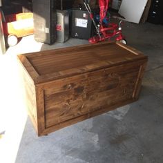 a large wooden box sitting in the middle of a room